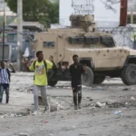Civilians navigate bodies in the streets amid violence gripping Haiti’s capital: AP photos