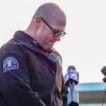 Court worker serving an eviction notice and a police officer fatally shot in Missouri, police say