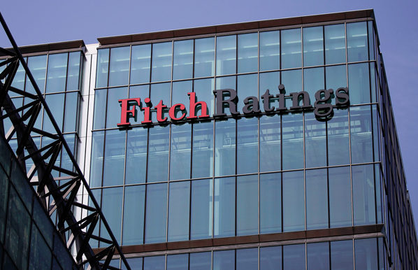 Fitch Ratings, One of Three Major Credit Rating Firms, Brings Territory Down Three Notches With The Promise It Will Sink Lower ... Soon