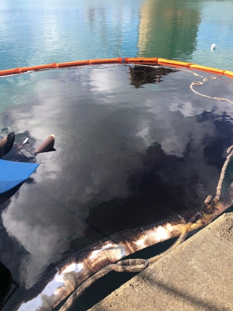 U.S. Coast Guard Works To Contain Oil Spill From Sunken Tugboat In Krause Lagoon On St. Croix