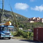 Tractor Trailer Smashes Into Utility Poles At Crown Bay Knocking Out Power, Telephone