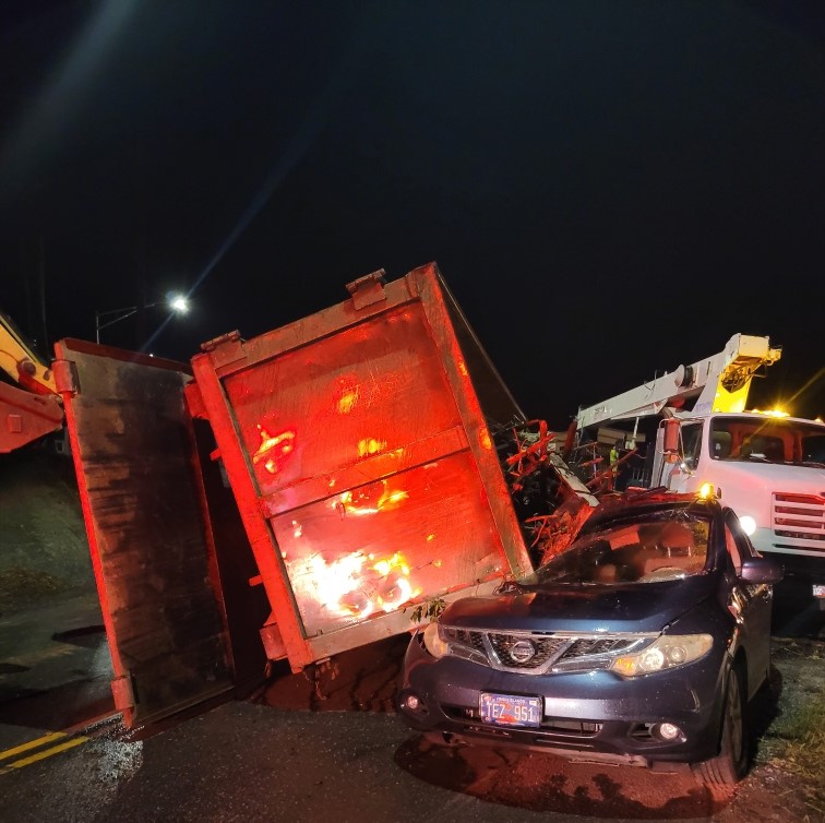 Over-Filled Flatbed Truck Tips Over Onto SUV, Injuring 2 People On St. Thomas