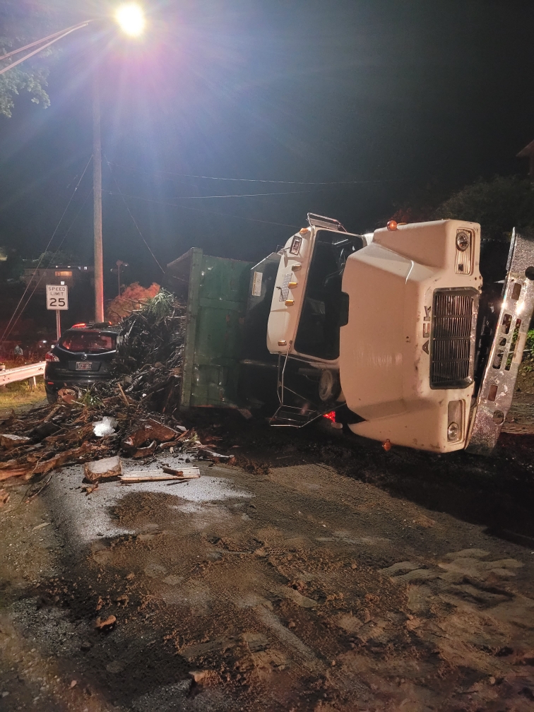 Over-Filled Dump Truck Tips Over Onto SUV Injuring 2 People On St. Thomas