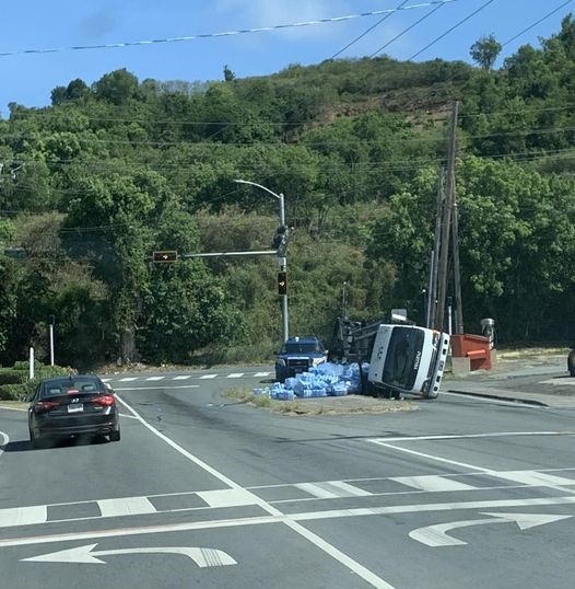 Delivery truck hauling water bottles overturns on Miracle Mile in St. Croix