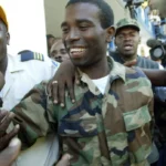 Authorities in Haiti hold former rebel leader Guy Philippe after the US repatriated him