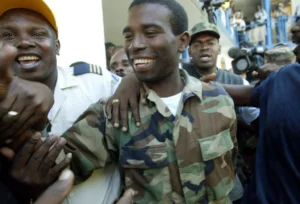 Authorities in Haiti hold former rebel leader Guy Philippe after the US repatriated him