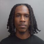 Traffic stop for tinted windows ends in man’s arrest on illegal gun, ammunition charges