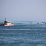 Coast Guard says a Dominican died after it fired at a fleeing boat carrying $11M worth of cocaine