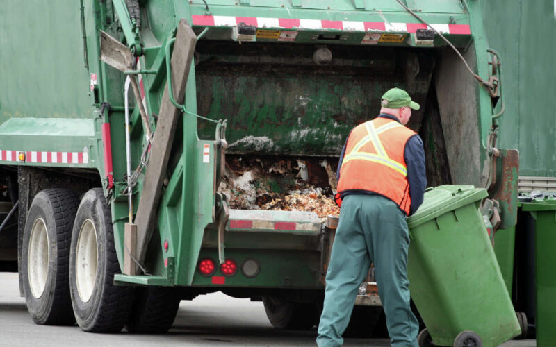 Woman tossing trash falls into dumpster, survives getting compacted in garbage truck