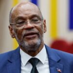 Haiti’s prime minister says he’ll resign as violent gangs rampage. It’s not clear who leads next