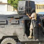 Police in Haiti struggle against gangs storming prison in latest surge of violence