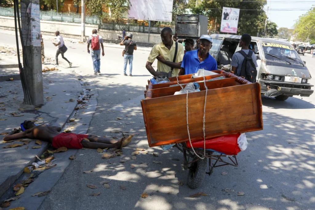 Civilians navigate bodies in the streets amid violence gripping Haiti’s capital: AP photos