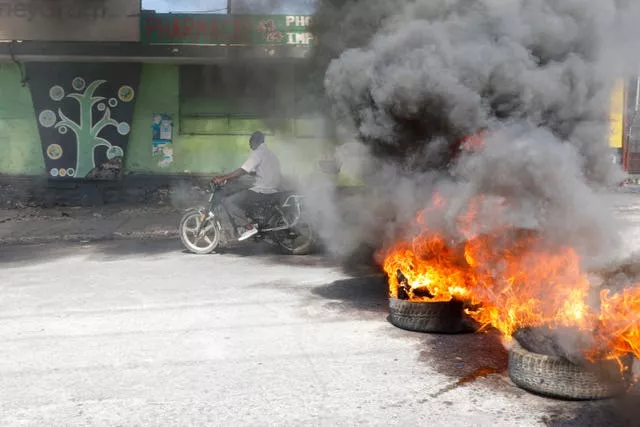 Haiti declares a curfew as it tries to restore order after weekend jailbreak, explosion of violence