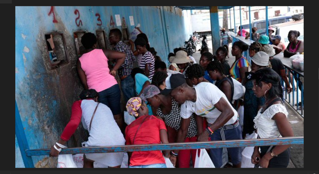 Hundreds of inmates flee after armed gangs storm Haiti’s main prison, leaving bodies behind