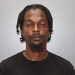 Man who ran red light gets caught with gun, ammunition in his car, police say