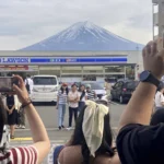 To fend off tourists, a town in Japan is building a big screen blocking the view of Mount Fuji