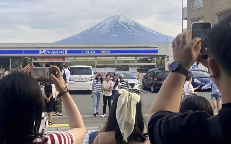 To fend off tourists, a town in Japan is building a big screen blocking the view of Mount Fuji