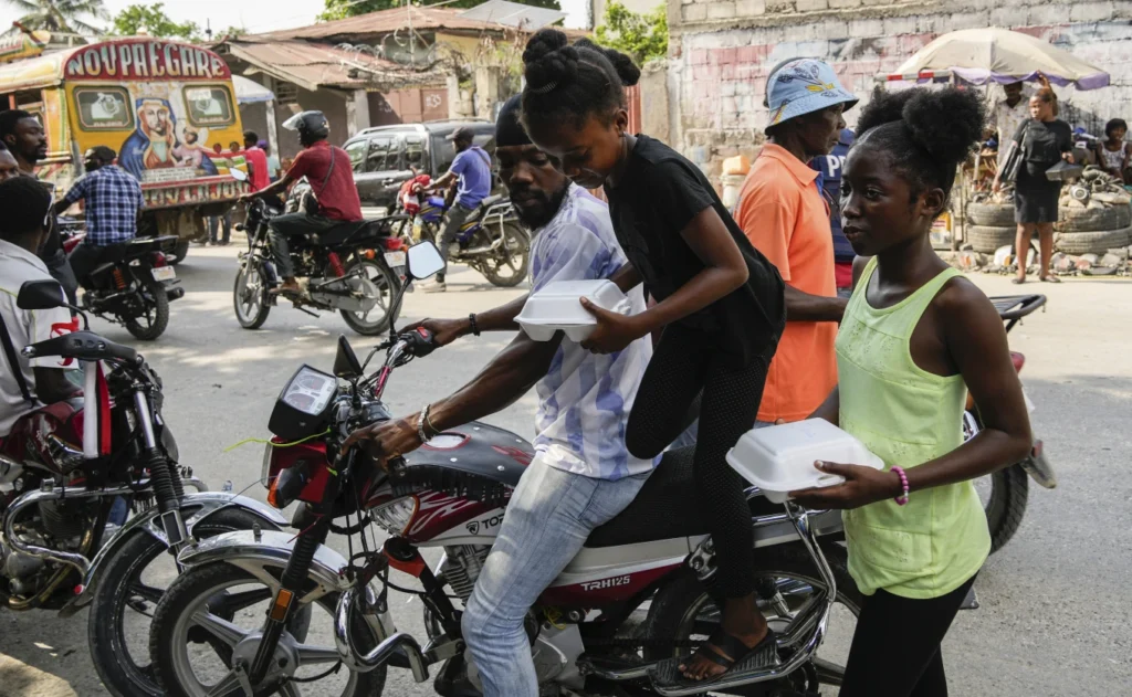 Forced to rebuild a life at 12, a Haitian girl joins thousands seeking an escape from gang violence