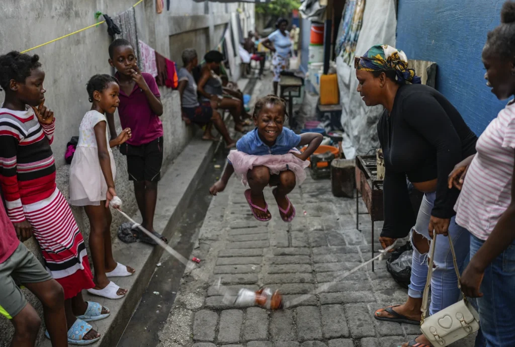 Forced to rebuild a life at 12, a Haitian girl joins thousands seeking an escape from gang violence