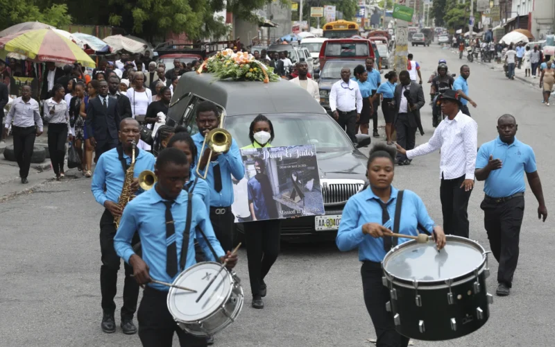 Hundreds mourn gang killings of a Haitian mission director and a young American couple