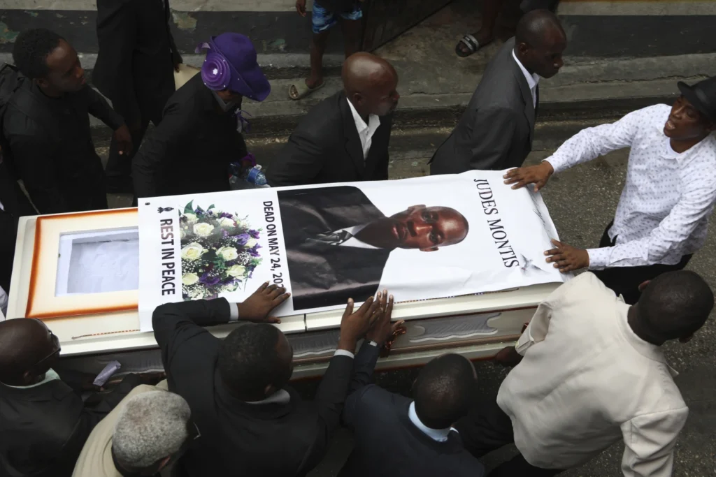 Hundreds mourn gang killings of a Haitian mission director and a young American couple