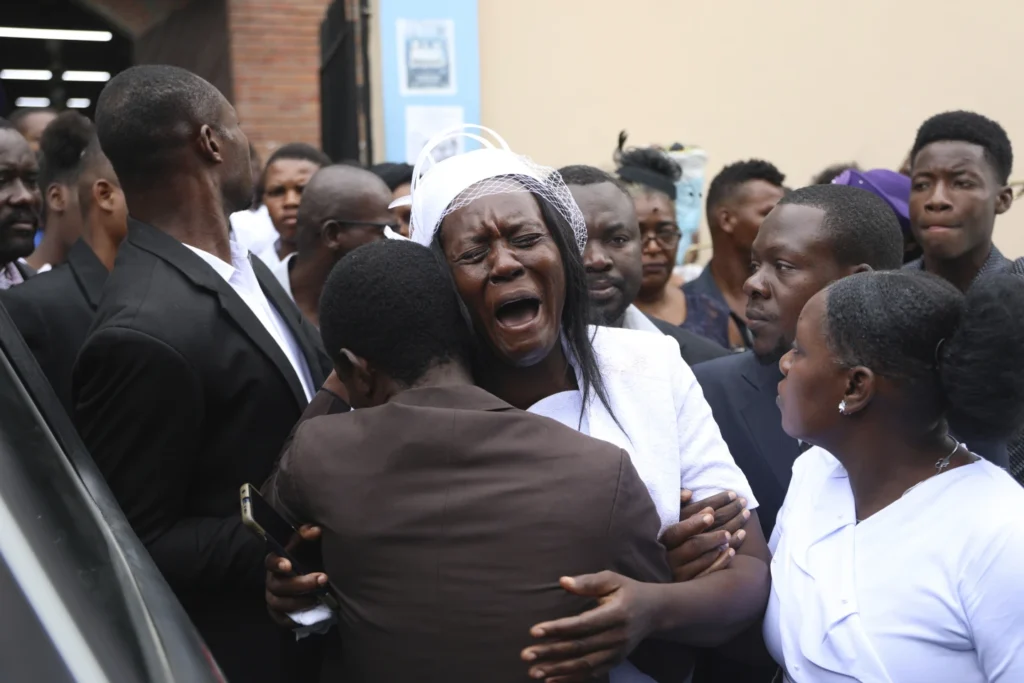 Hundreds mourn gang killings of a Haitian mission director and a young American couple