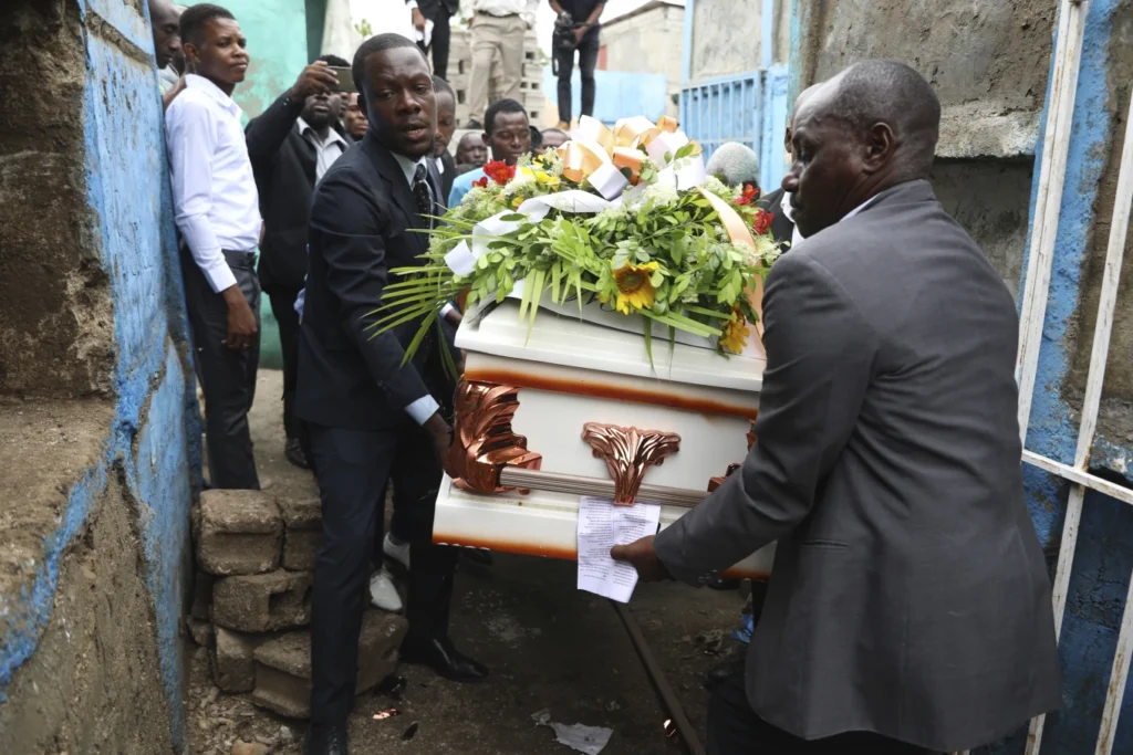 Hundreds mourn gang killings of a Haitian mission director and a young American couple