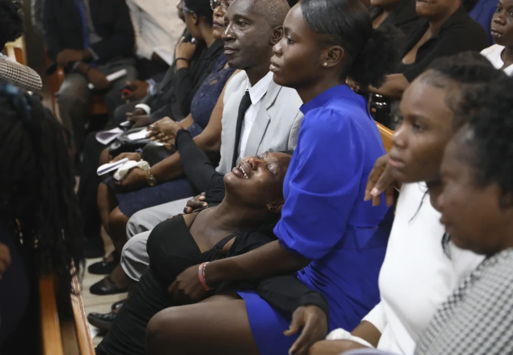 Hundreds mourn gang killings of a Haitian mission director and a young American couple