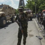 Haiti’s prime minister orders gangs to drop weapons and promises to take back control of the capital