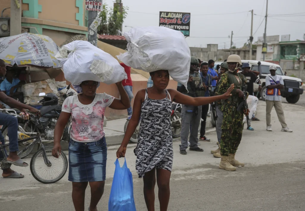 Haiti’s prime minister says Kenyan police are crucial to controlling gangs, early days are positive