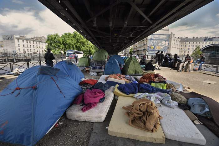 Migrants and homeless people are cleared out of Paris during the Olympics