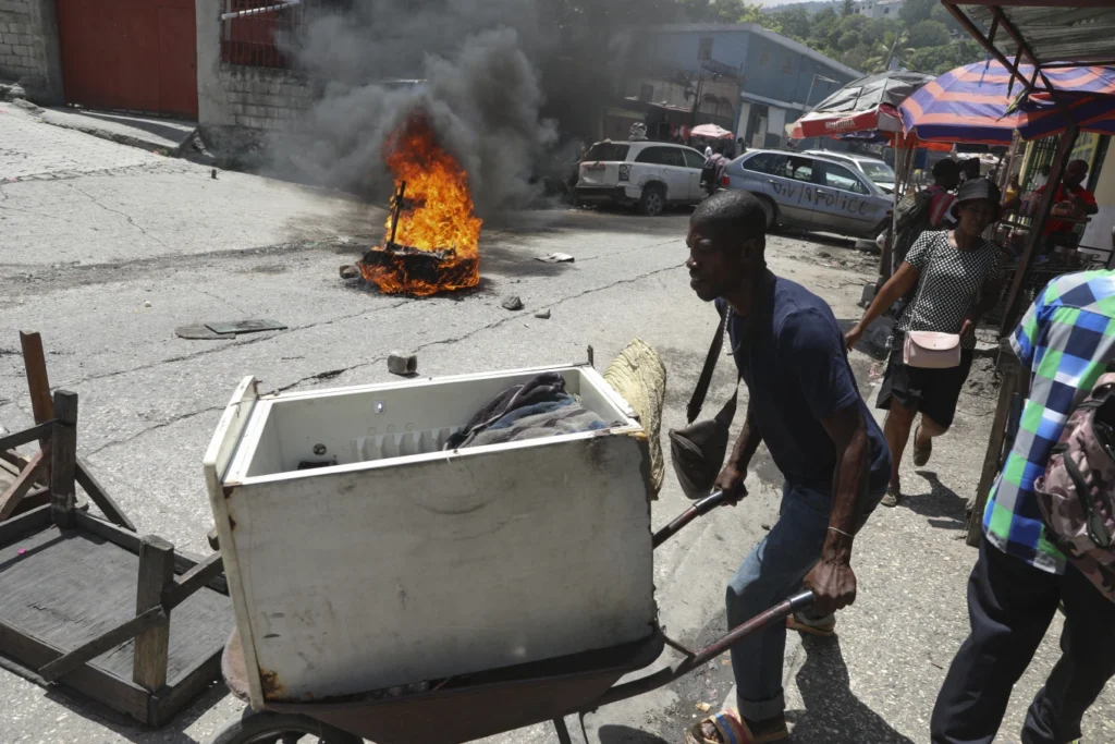 Haitian police tear-gas peaceful protesters as they demand help in stopping gangs