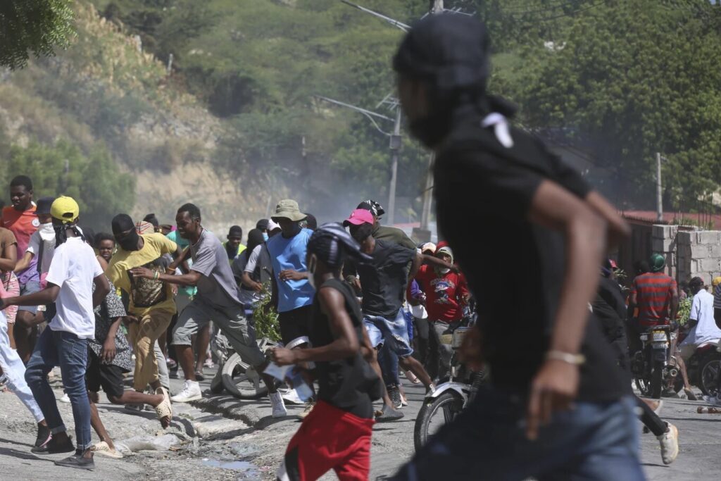 Haitian police tear-gas peaceful protesters as they demand help in stopping gangs