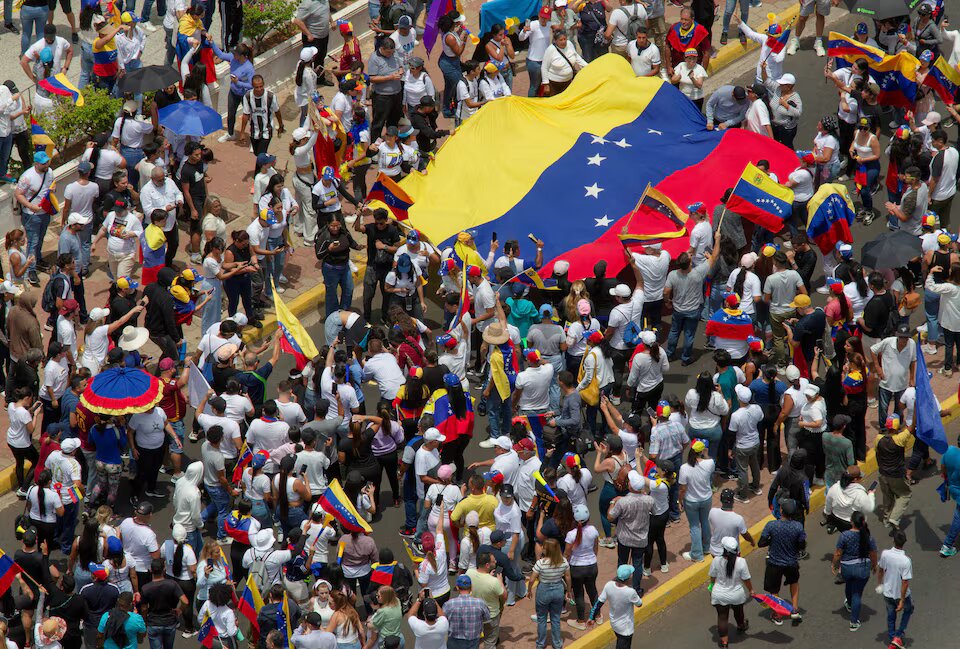 Venezuelans march over contested election, number of detained rises