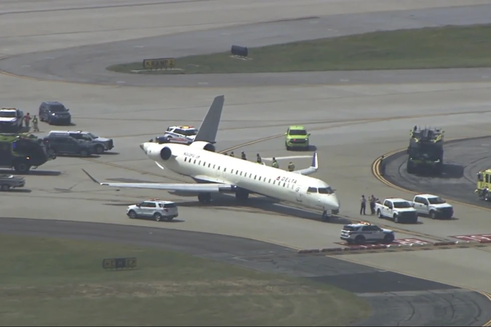 Two Delta planes collide on an Atlanta taxiway, knocking the tail off one