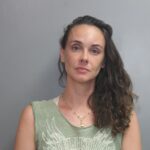 Woman arrested for DUI after crashing into marked police vehicle