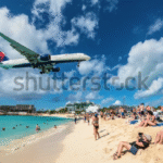 The eerie Caribbean beach where planes fly right above your head – but tourists still call it a tropical paradise