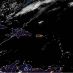 Partly sunny with a stray shower this afternoon, high 86