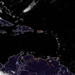 Mostly sunny, breezy, high 86